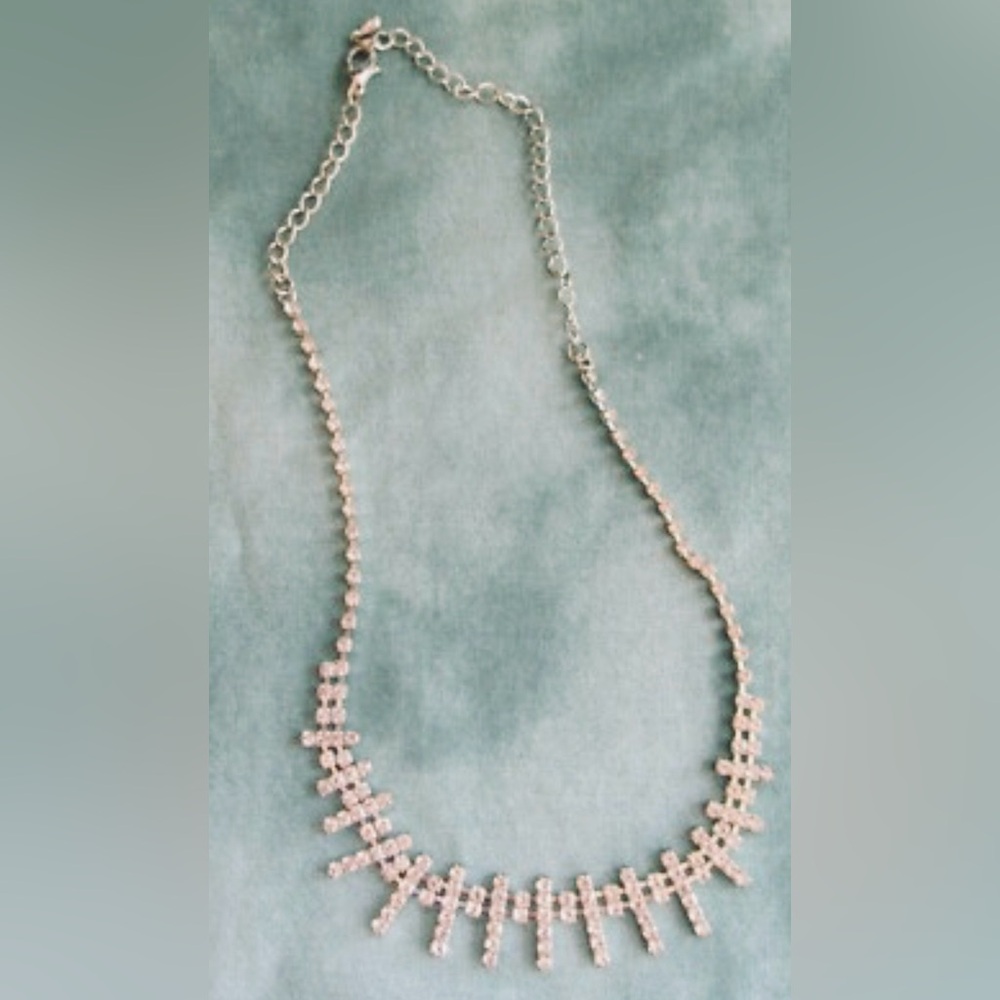 Elegant and dainty silver tone necklace set with  clear rhinestones